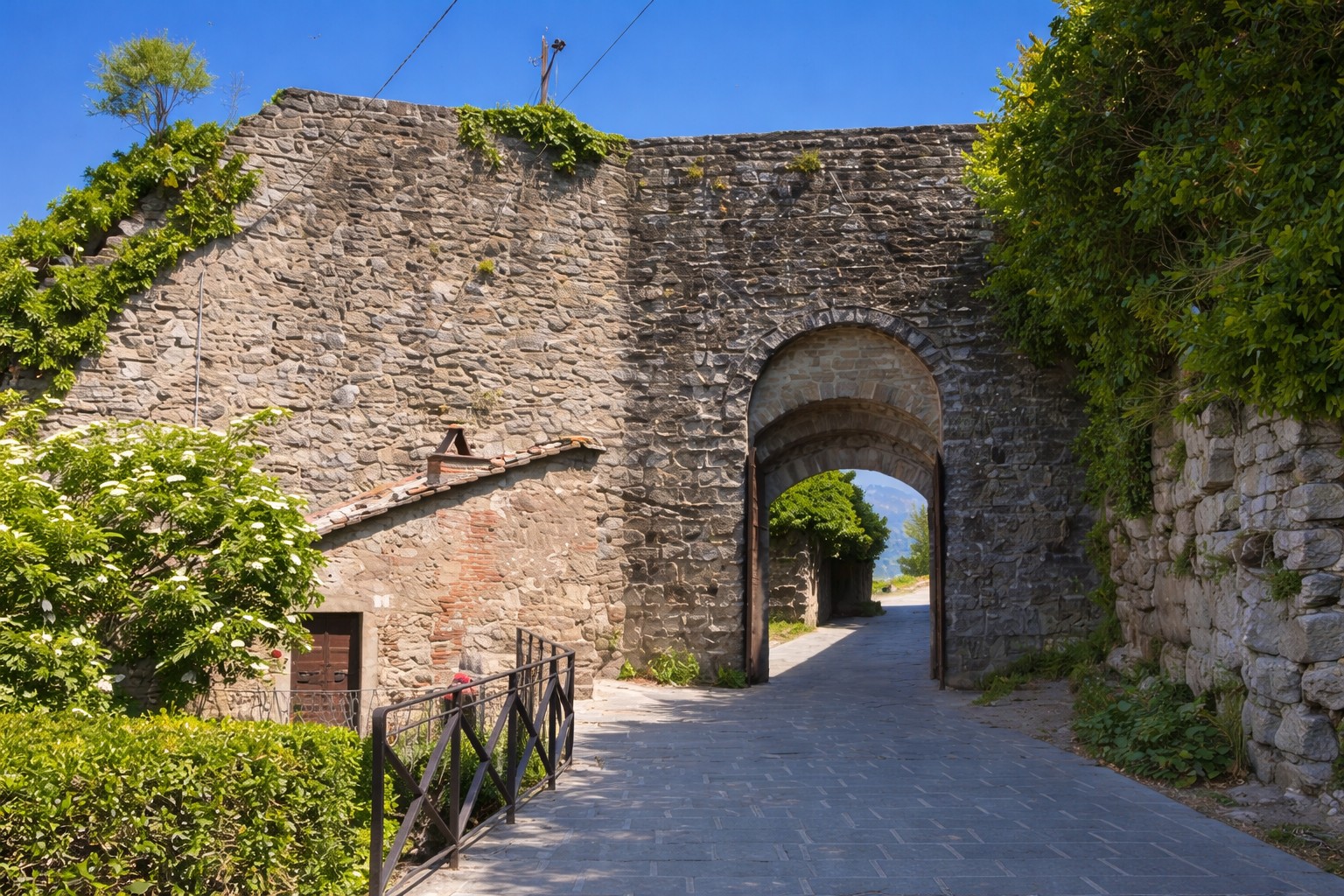 Etruscan walls of Cortona — ancient stone fortifications over 3000 years old surrounding the hilltop town, Tuscany