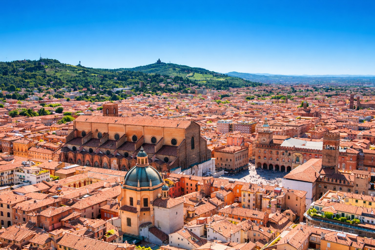 Aerial panoramic view of Bologna historic centre with Piazza Maggiore, medieval towers and terracotta rooftops, Emilia-Romagna Italy