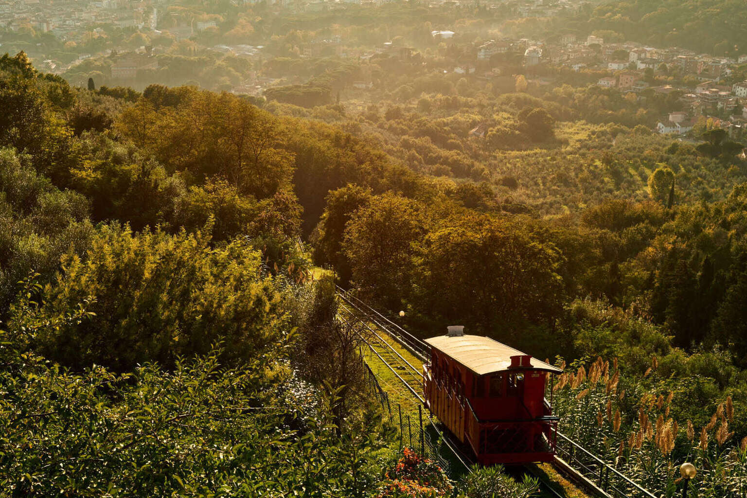Panoramic view over the Valdinievole valley from Montecatini Alto hilltop, with rolling hills and Tuscan countryside below