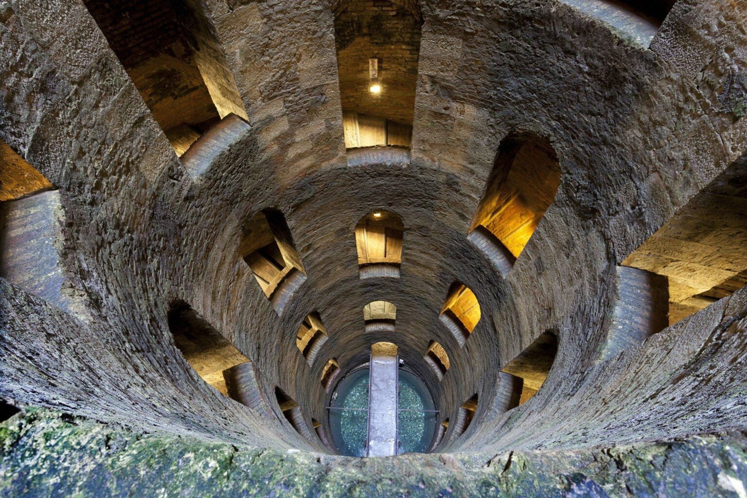 Pozzo di San Patrizio interior looking down — double helix well 53 metres deep carved into tufa rock, Orvieto Umbria Italy