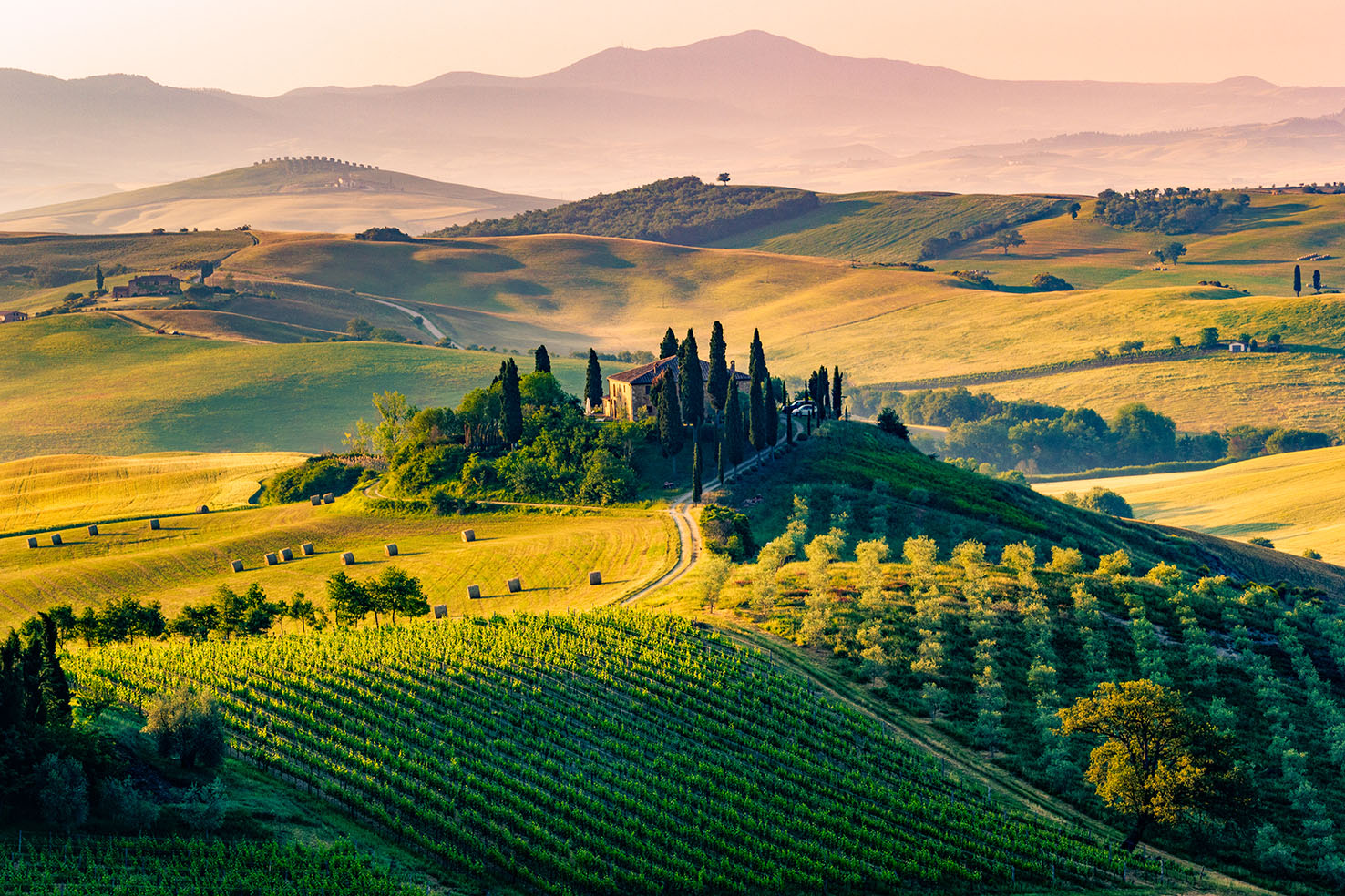 Val d'Orcia panoramic view from Montepulciano — rolling hills with cypress trees and vineyards, UNESCO landscape Tuscany