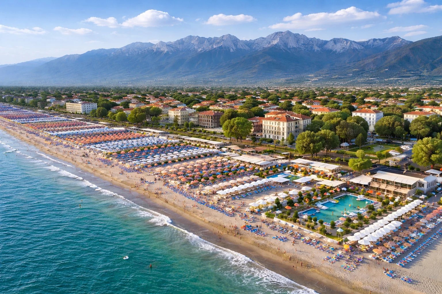 Aerial view of Forte dei Marmi beach with Apuan Alps in the background — private chauffeur transfer Versilia