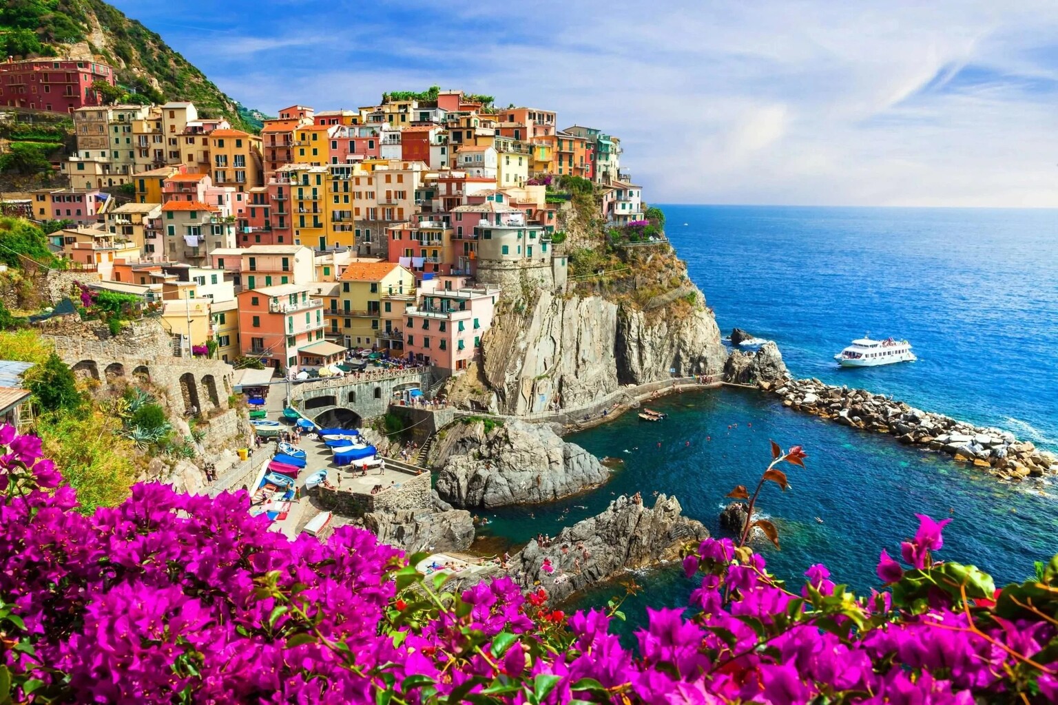Manarola Cinque Terre — colourful village with bougainvillea and harbour